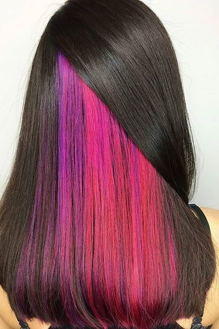 Fuchsia pink panel peekaboo on sleek straight black hair