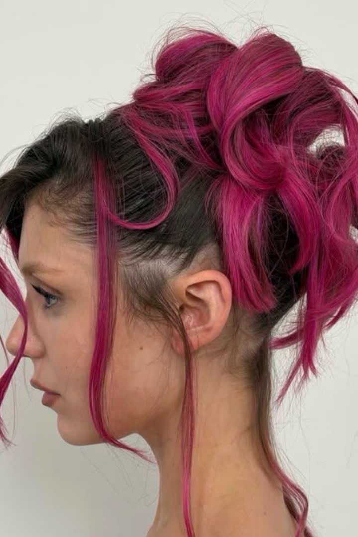Pink stripe styled into space buns updo
