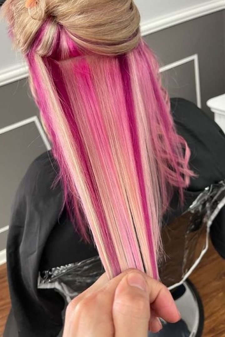 Long straight dark pink underlayer reveal on dark hair