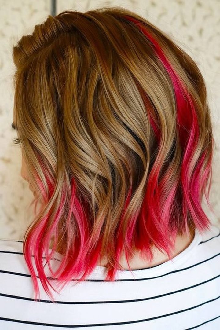 Hot pink peekaboo streaks on blonde balayage bob