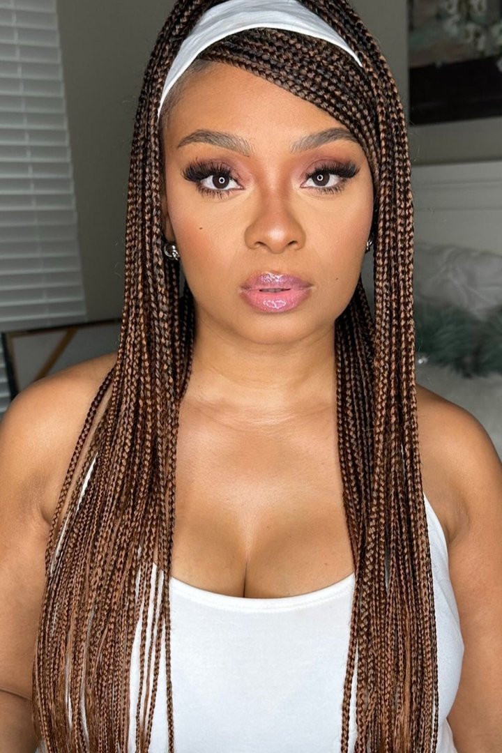 Knotless braids hairstyle styled with a headband