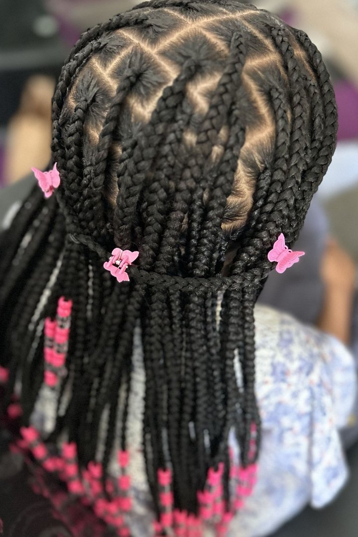 Knotless braids decorated with butterfly clips