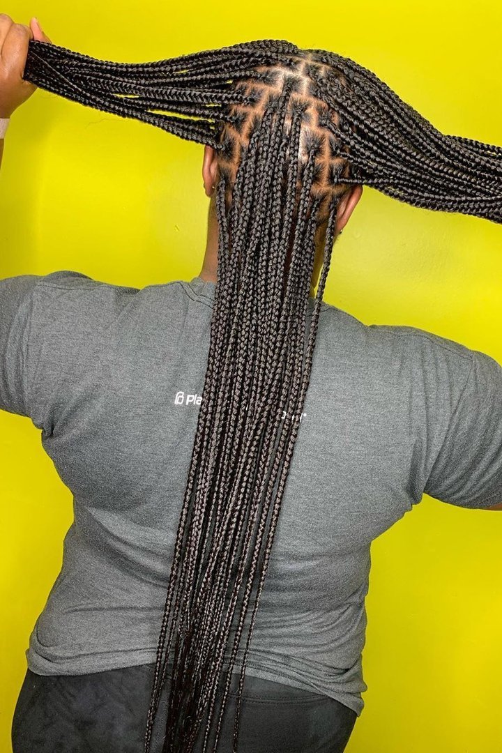 Waist-length micro knotless braids hairstyle