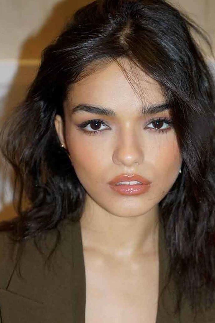 Kitty cut on thick hair with lightened feathered ends