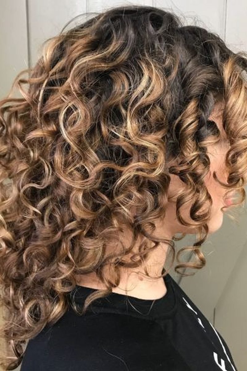 Subtle mocha shimmer on curly hair
