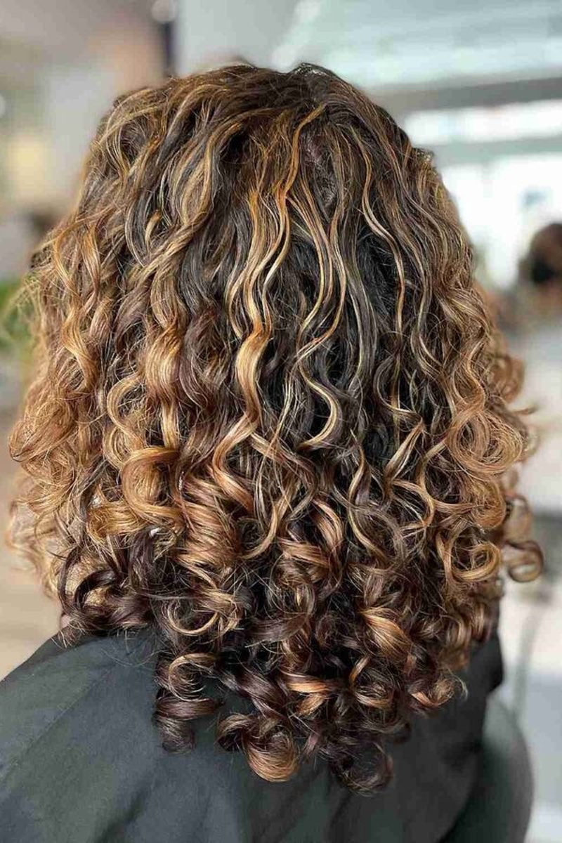 Cool toned mocha balayage on curls
