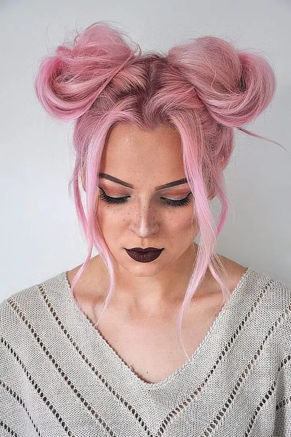 Space buns with gold glitter for New Year's Eve party hairstyle