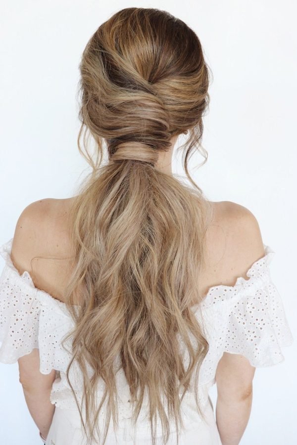 Half-up ponytail with soft waves, back view