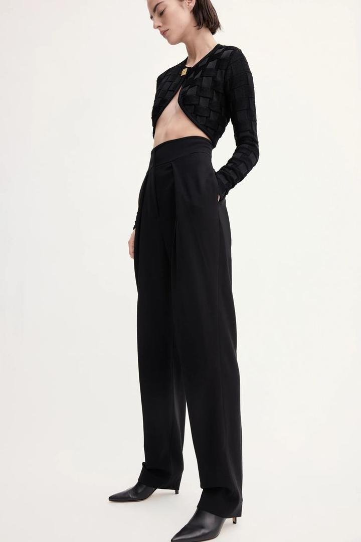Black cropped textured cardigan with high-waisted black wide-leg trousers