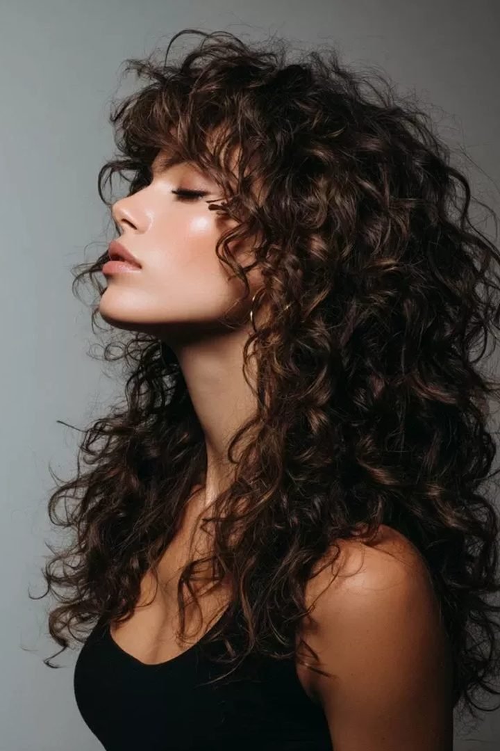 Side profile of voluminous defined curly hairstyle