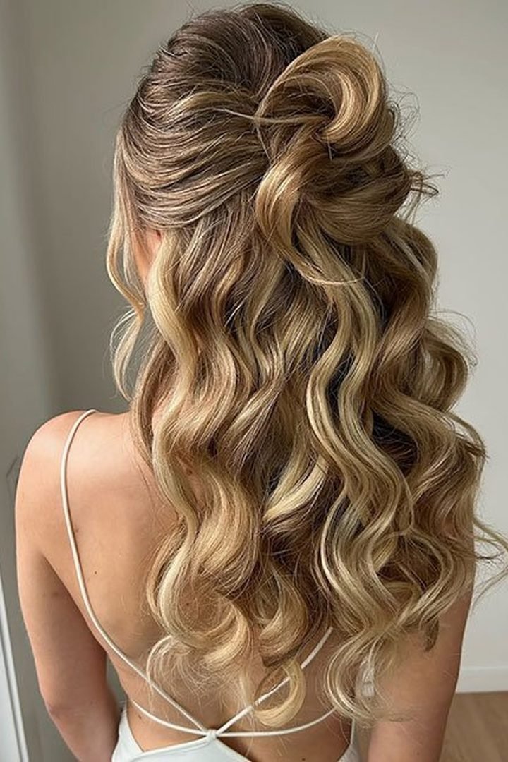 Back view of half-up half-down wavy hairstyle