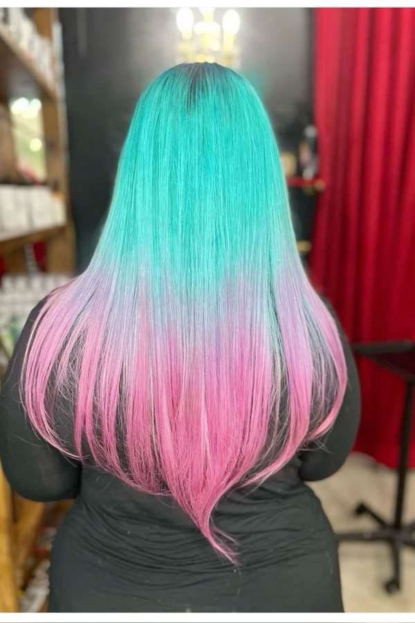 Teal roots melting into pink ends ombre hair colour