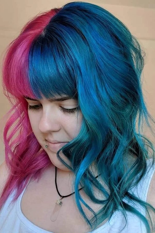 Pink and teal split hair with full bangs