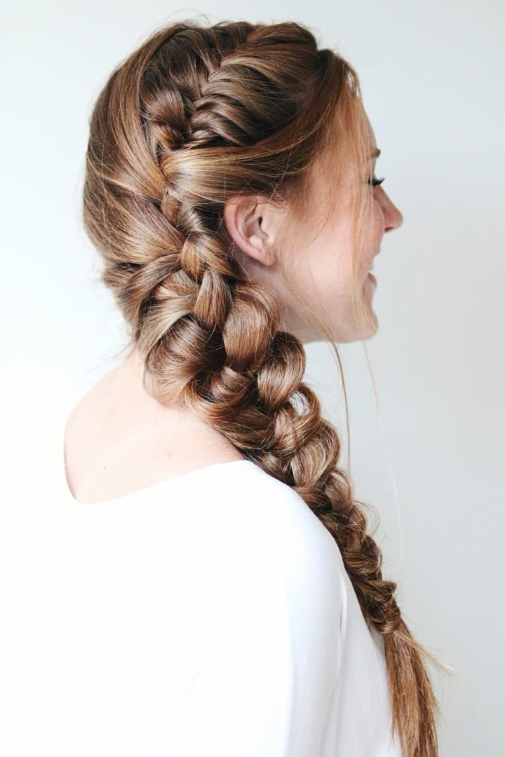 Side fishtail braid hairstyle worn over one shoulder