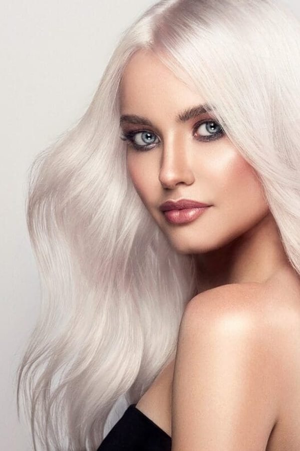 Icy platinum blonde hair color, pale winter-white waves, front portrait