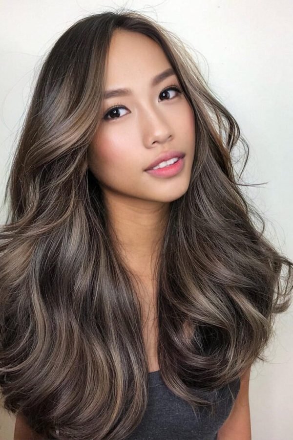 Smoky ash balayage hair color, dark roots melting into ash grey ends