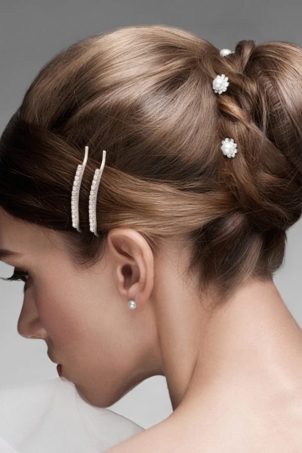 Romantic low updo decorated with pearl pins